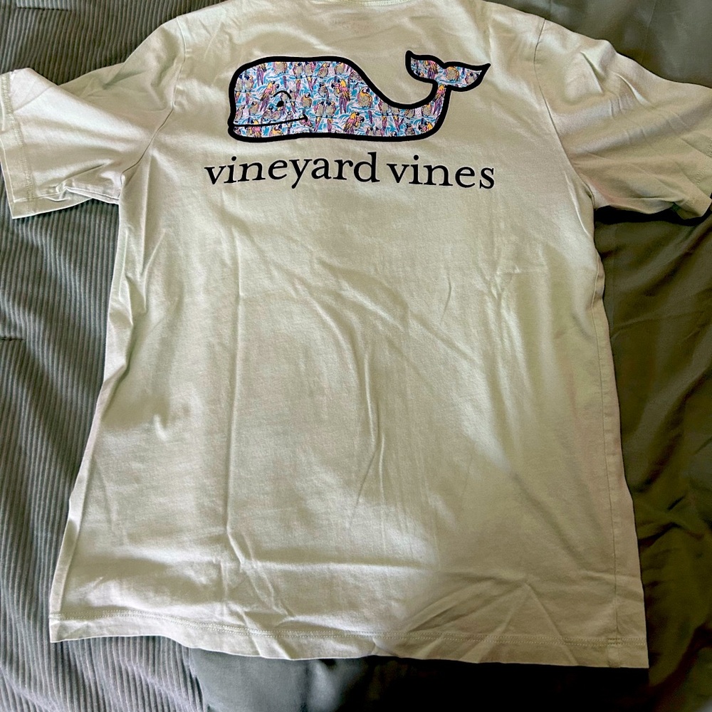 Mint green. Appears light in photo and is darker in person.